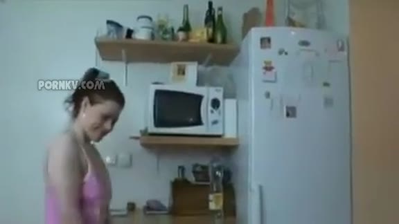 Grandpa cleaning floor with young girl